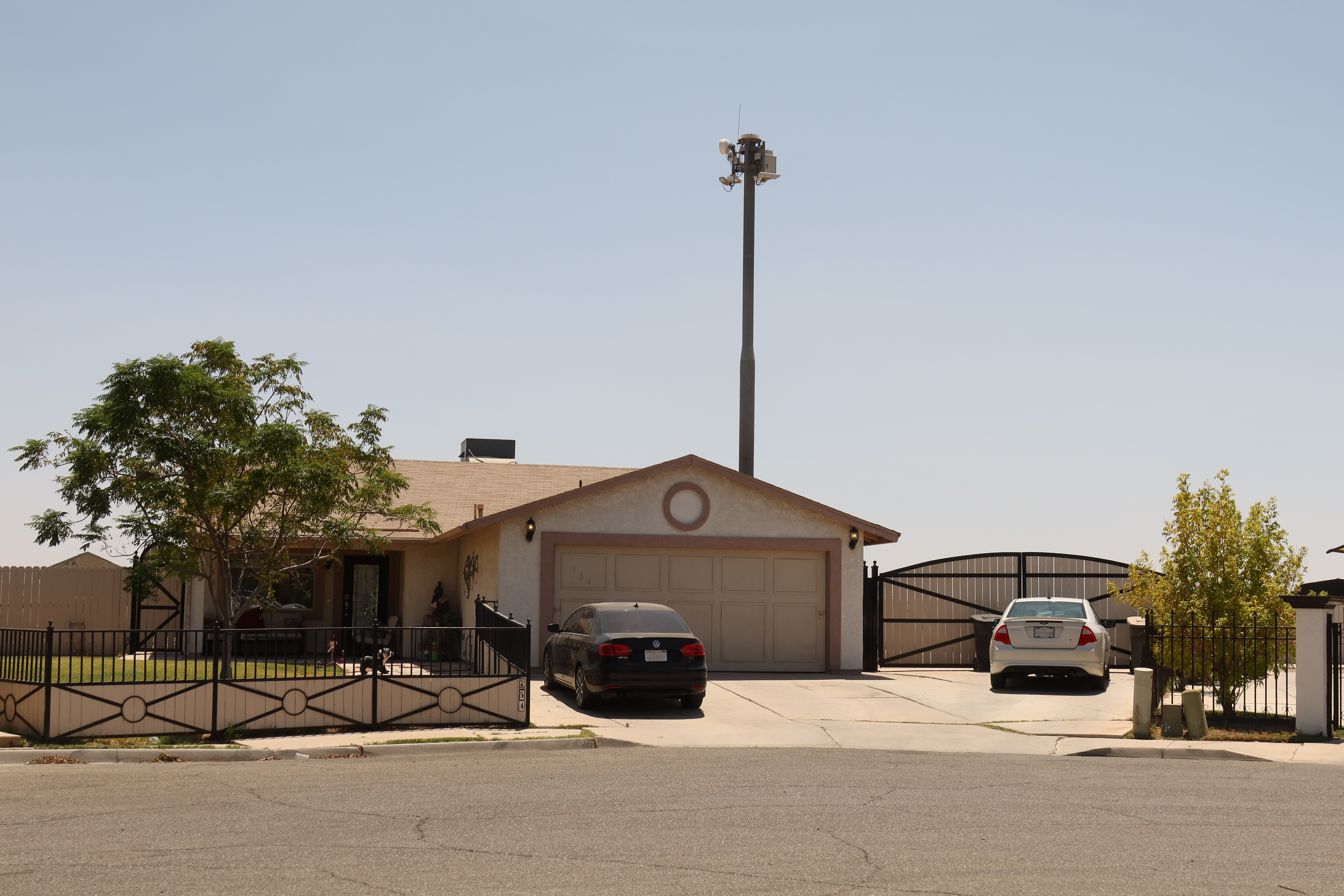 EFF A surveillance tower over a one-story home.