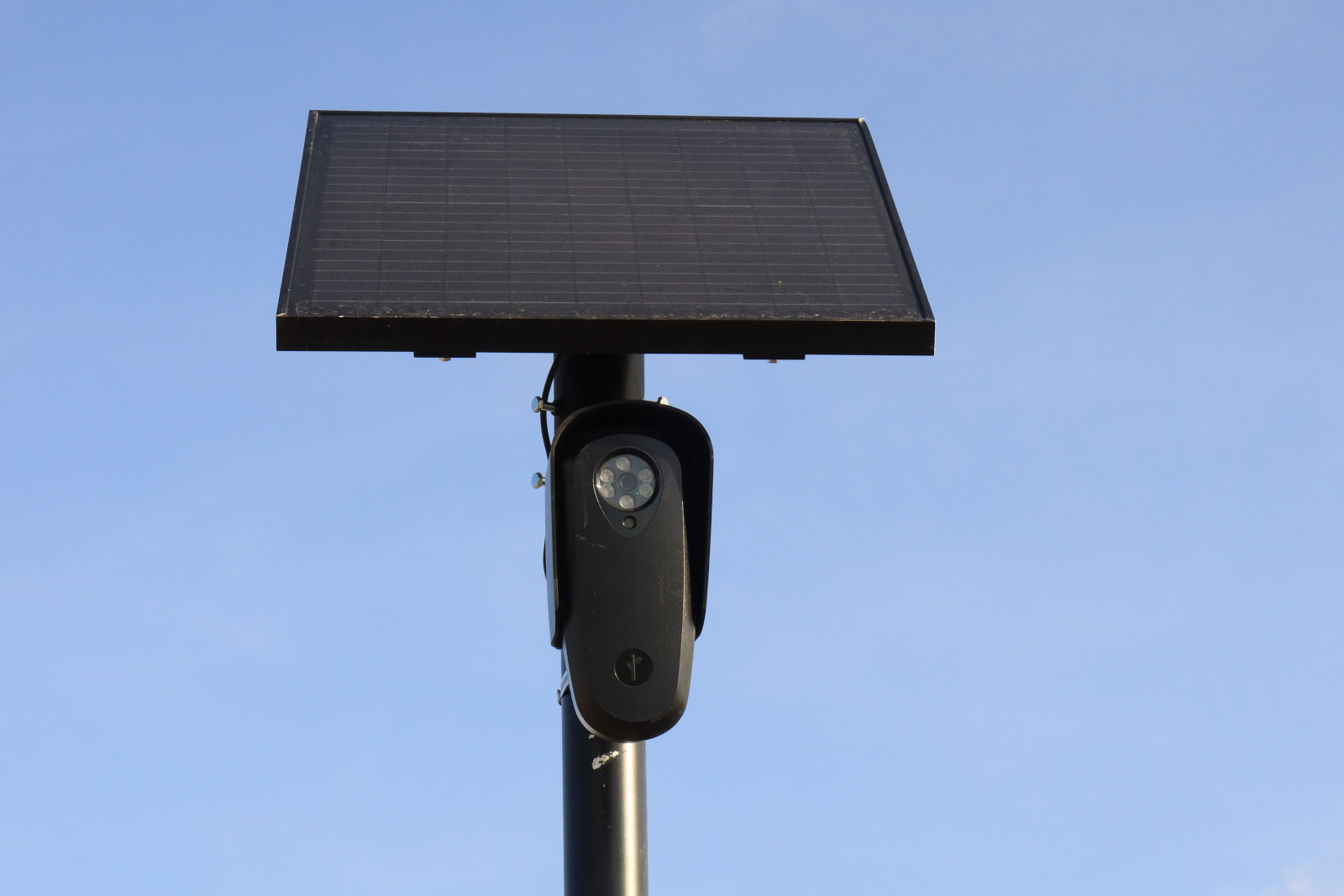 A close-up of a Flock Safety camera on a pole A close-up of a Flock Safety camera on a pole